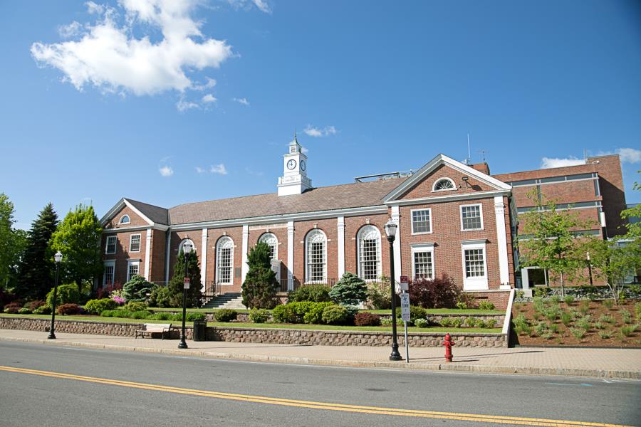 Red brick Alumni Hall with palladium windows across front and clocktower on top