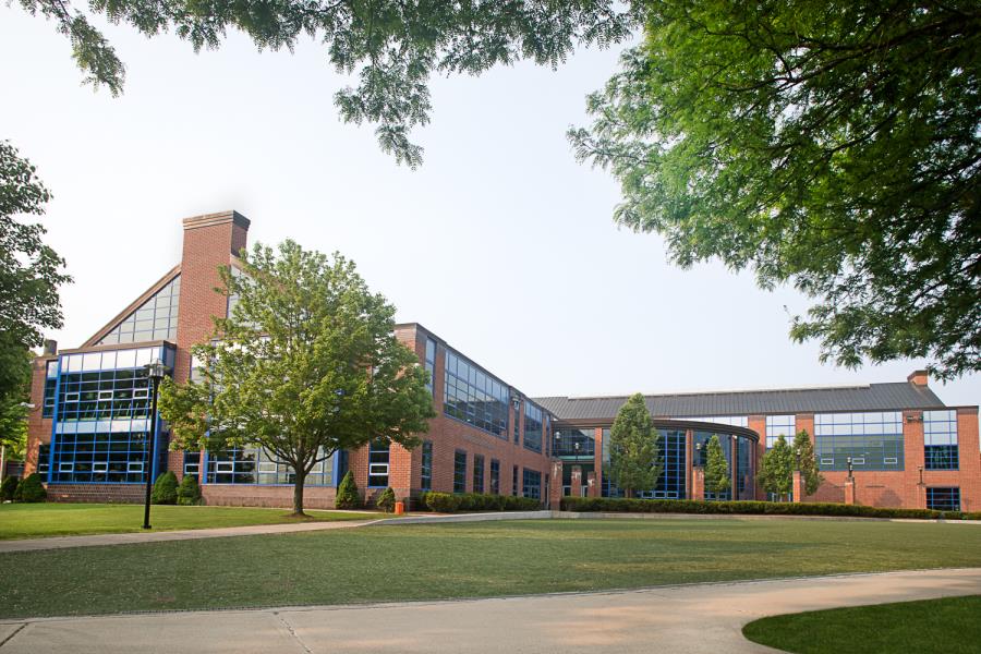 Sprawling Campus Recreation Center showing grass and trees out front