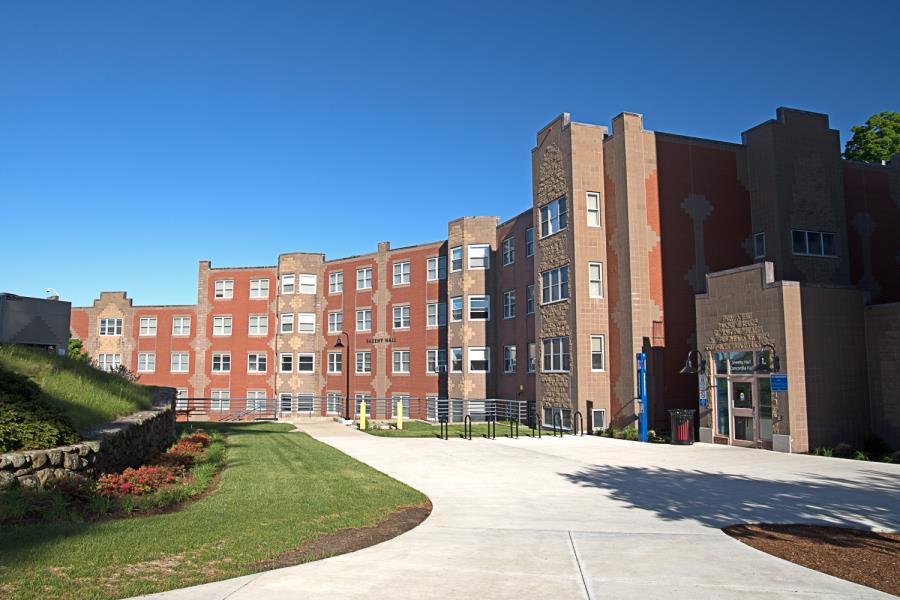 Interesting two-toned brickwork on front of alternating facades of curved Sheehy Hall residence