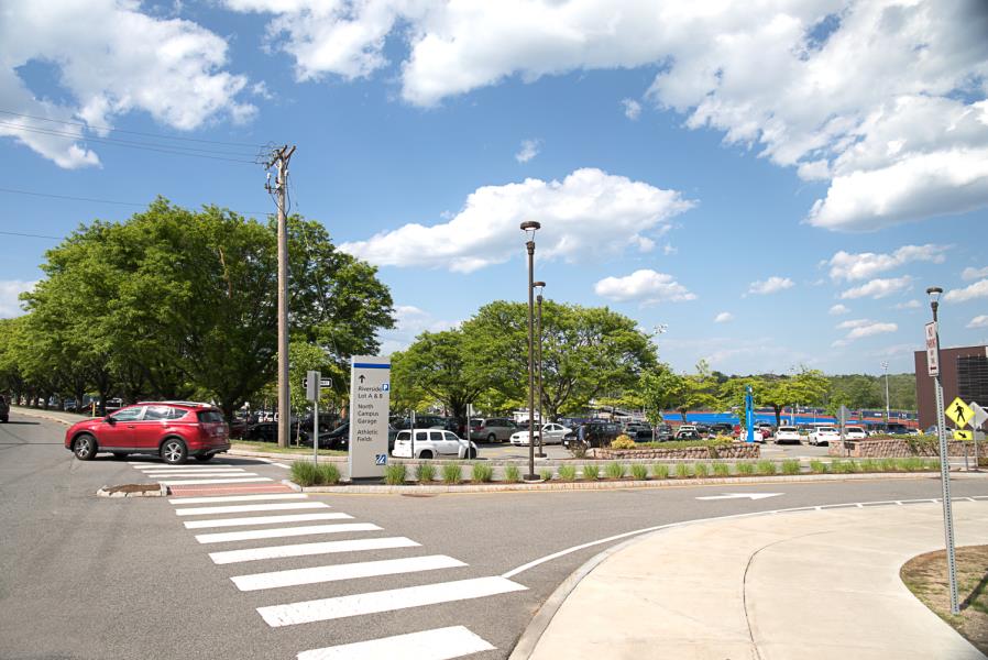 Crosswalk and sign in front of Riverside Lots A & B