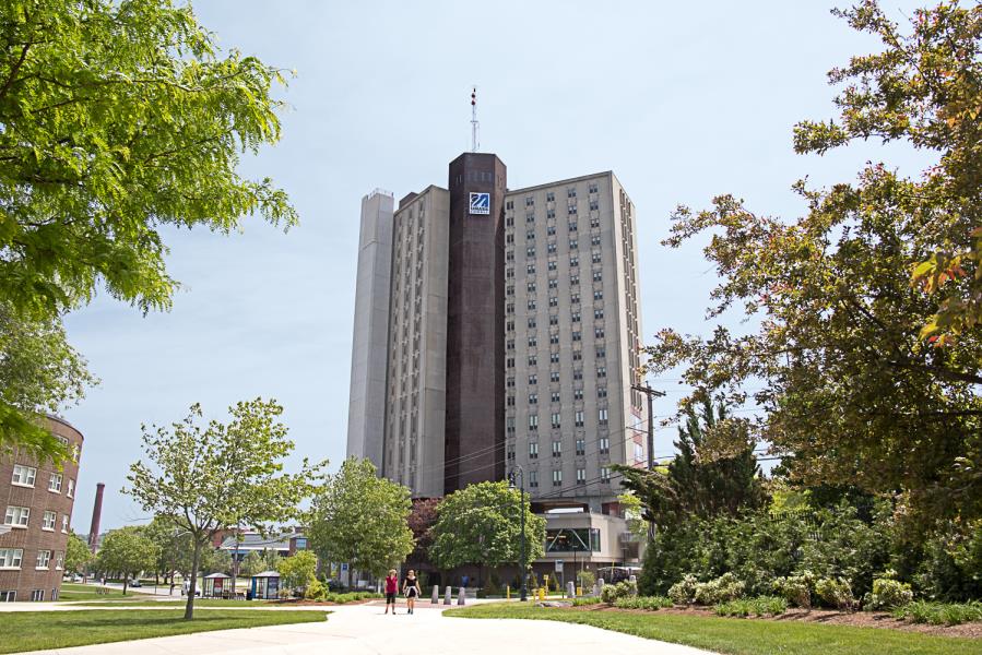 18-story Fox Hall, shown at distance from walkway leading to building