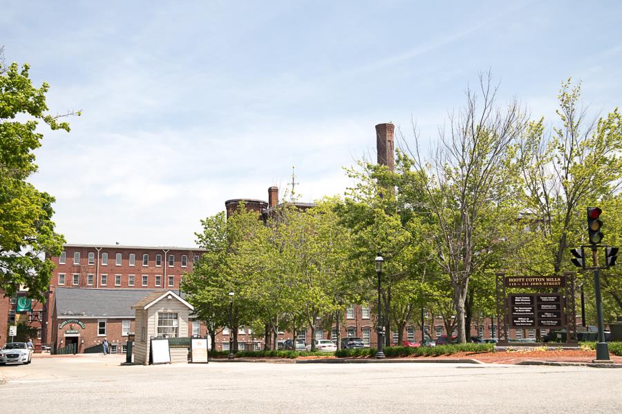 Boott Cotton Mills sign and guard shack in front of mill complex shot from across street